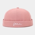 Detailed view of pink canvas docker hat with white embroidered me lettering and six-panel crown - Adjustable / Dusty Pink