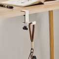 White adjustable metal desk hook for bags with a black screw knob on a wooden table - Foldable Type / Cream
