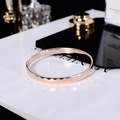 Elegant rose gold open bangle with geometric diamond cut pattern in titanium steel - 6mm Width / Rose Gold