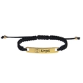 Close-up of a black braided bracelet with a gold metal bar featuring custom tiger engraving - Silver / Black Bracelet