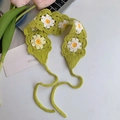 Detail of green crochet headband with white daisy pattern and knitted straps - Green Sunflower