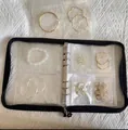 Detail view of black zipper jewelry binder with clear loose-leaf PVC storage pockets - Black Zipper Silver Clip 3/5 Inch Set (With 60 Bags)