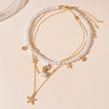 Set di 3 collane dorate con stella marina conchiglia e perle per vacanze in spiaggia - Oro