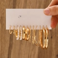 Golden geometric earrings set featuring pearl hoops and textured metal rings on display card - KC Gold (0507)