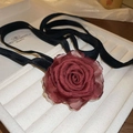 Handmade burgundy fabric rose choker with a black velvet ribbon on a display tray - Necklace-Red