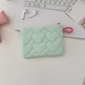 Macro shot of mint green quilted heart pattern bag on desk with stationery and accessories - Green Heart (Zipper Coin Pouch)