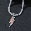 Detail shot of iced-out lightning bolt pendant with pink gems on a silver tennis chain - Pink Pendant + Necklace