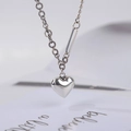 Elegant silver heart pendant necklace with mixed twist and bead chain on white background - 3D Heart Necklace