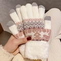 Close-up of winter knit gloves with reindeer pattern, fleece cuffs and touch screen tips - White