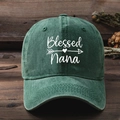 Close-up of Blessed Nana embroidery and heart pattern on washed green cotton baseball cap - Dark Green