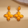 Detail of yellow enamel flower earrings with gold-plated frame on beige textured background - Flower Shape (HE29516) / Yellow (S925 Pin)