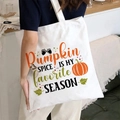 White canvas tote bag featuring an artistic pumpkin spice autumn print with leaves - Pumpkin Spice Is My Favorite Season / White
