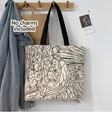 Detail of cream canvas tote bag with artistic black and white jungle angel illustration - Angel Beige Bag