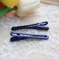 Detail shot of two dark blue gradient hair clips on elegant white lace background - Navy Blue