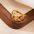 18k gold plated stainless steel open ring with a minimalist leaf design on a wood tray - Gold 20
