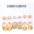 Detail view of a 6-pair gold earring set with studs and textured C-hoops on a display card - 6 Pairs Set - Gold Exaggerated (8542)