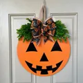 Halloween pumpkin door hanger featuring bright orange wood with a festive bow and leaves - Style F (Smiling Pumpkin)