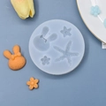 Dettaglio dello stampo in silicone blu con forme di stella marina coniglio e fiori - Stampo Rotondo Coniglio Stella Marina Fiore (2)