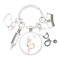 Doctor-themed silver keychain with stethoscope, medical charms, and floral letter C charm - Letter C Stethoscope