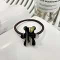 Cute teddy bear charm hair tie with black and gold marble pattern on white book - Bear Cookie Hair Tie / Black Gold