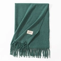 Deep green cashmere-like scarf with long tassels and fabric brand label on white surface - 70*200cm / Heather Green