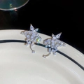 Orecchini a stella con nappa in finitura argento e pavé di zirconi brillanti - Argento