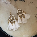 Detail of bohemian gold flower earrings with white cotton tassels on a decorative tray - 22# White Round Enameled Sun Hook