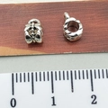 Silver bow-shaped spacer bead with ruler showing 1cm size for DIY jewelry making - Bow Tie Bail Connector