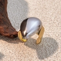 Modern two-tone stainless steel ring with 18k gold band and silver teardrop element - Teardrop Pebble - Gold Silver Two-Tone