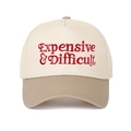 Close-up of red Expensive & Difficult embroidery on a contrast five-panel baseball cap - Beige & Khaki