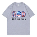 Grey crew neck T-shirt with American flag GOD ONE NATION graphic print in a flat lay view - Gray