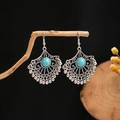 Artistic detail of vintage silver bohemian earrings with turquoise stones and bead tassels - E5442-1 (Silver Teal Hollow Fan)