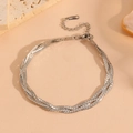 Detailed macro view of multi-strand silver stainless steel snake chain with lobster clasp - Silver Bracelet
