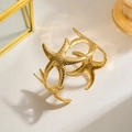 Golden starfish cuff bracelet with textured finish and elegant ocean-inspired design - Gold Starfish Shell