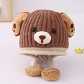 Detail of baby winter knit hat with puppy ears and bone charm embroidered with Baby - 3-8 Years / Coffee