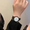 Minimalist quartz watch with a black strap and white round dial on a person's wrist - Small Size - Scale White Dial