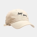 Beige cotton baseball cap with black Keep Going embroidery and adjustable strap - Beige