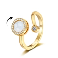 Rotating fidget ring in gold finish with white opal and pavé set sparkling crystals - Gold Cat Eye Stone