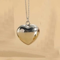 Detailed macro view of a 3D heart pendant with a polished finish on a fine cable chain necklace - Extra Large (3.0cm) / Silver