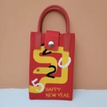 Red knitted handbag with yellow snake pattern and Happy New Year woven text design - 2025 Year of the Snake Series (Red)