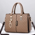 Brown geometric embossed tote bag with dual handles and gold leaf charm detail - Khaki