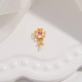 Macro view of a gold-plated S925 silver clover pendant setting with a pink zircon stone - Style C / Gold