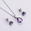 Detailed view of titanium steel necklace and earrings with purple teardrop zircons - Purple Set (AML-JS-094)