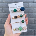 Detail of four candy-colored hair clips with green resin and pearls on a card - Luxi Style (4 Piece Set)
