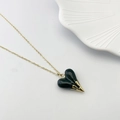 Minimalist gold necklace featuring a dark green heart pendant with golden flame detail - Dark Green