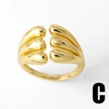 Close-up of golden irregular layered open ring featuring a flowing streamlined design - Multiple Streamline Style (C)