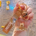 Capybara mini magic cube keychain with brown woven strap and glitter box - Liquid Oil Capybara - Barrel