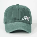 Close-up of washed dark green cotton baseball cap with Faith text and pink cross print - One Size / High Crown Style / Teal