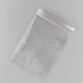 Transparent PVC jewelry storage bag with seal strip and hanging hole on grey background - 8*12cm with Side Hole