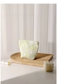 Close-up of floral jacquard cosmetic bag with golden flower zipper and brand label - Small / Floral Moss Green